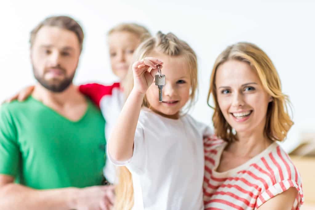Happy Family and a child holding a key